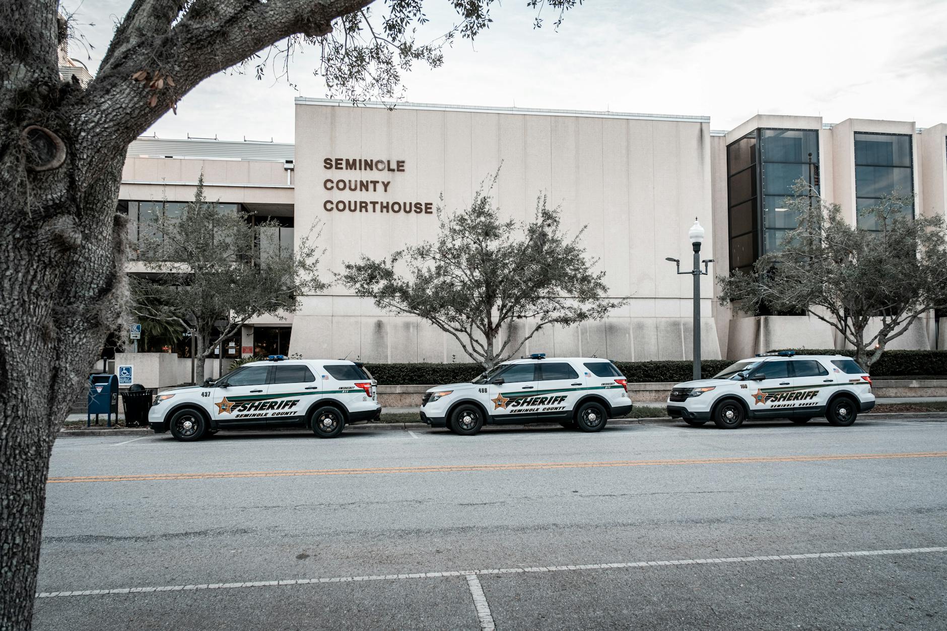 Sheriff vehicles parked outside the Seminole County Courthouse, capturing law enforcement presence.